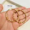 Twist Medium Gold Hoop• Valeria earring